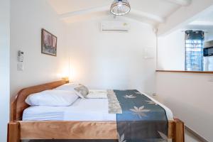 A bed or beds in a room at Gîte Dalina