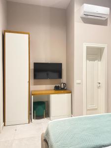 TV a/nebo společenská místnost v ubytování Toto Hotel & Apartments