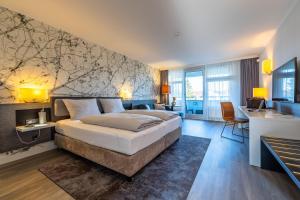 MASEVEN Stuttgart SI Centrum ehem SI-SUITES客房内的一张或多张床位