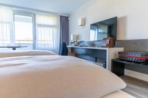 MASEVEN Stuttgart SI Centrum ehem SI-SUITES客房内的一张或多张床位