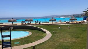 a resort with a swimming pool and a beach at San Alfonso del Mar Algarrobo La piscina más grande de América in Algarrobo
