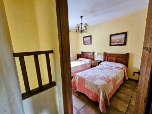 A bed or beds in a room at Alojamientos rurales el hosquillo, lugar de bienestar
