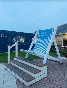 a blue and white chair sitting on some steps at Caravan-Blackpool-FamilyFriendly-Activities in Fleetwood