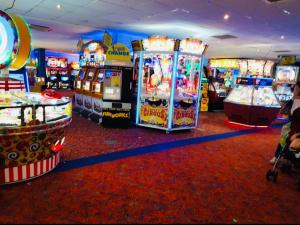 a room with many arcade games and video games at Caravan-Blackpool-FamilyFriendly-Activities in Fleetwood