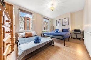 Ένα ή περισσότερα κρεβάτια σε δωμάτιο στο Quadruple - King Room