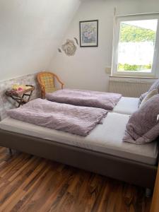 Postel nebo postele na pokoji v ubytování Ferienwohnung Nickel