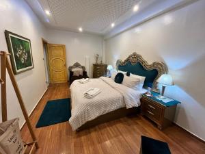 Postel nebo postele na pokoji v ubytování Maison d'hôte Darkom Kech + 21 fotografií