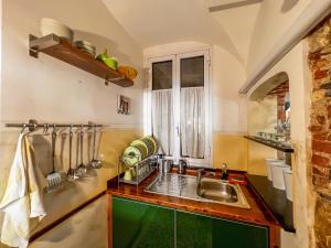 a kitchen with a sink and a window at lovingenoa Natural - Light in Genoa +40 photos