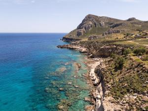 an aerial view of the ocean and a rocky coastline at Laftiras Sea View Home in Archangelos