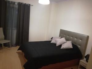 Ένα ή περισσότερα κρεβάτια σε δωμάτιο στο T2 Alto Quintão