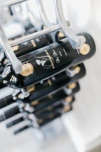a bunch of bottles of wine in a wine rack at Bloemenzee Boutique B&B in Gordonʼs Bay