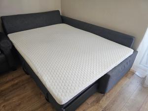a bed in a room with a mattress at Ana Residence in Timişoara