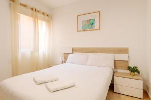 Łóżko lub łóżka w pokoju w obiekcie Montefaro Spacious Townhouse - Beach & pool