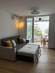 a living room with a couch and a table at Sea and Mountains in Gran Alacant +23 photos