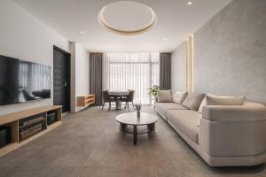 a living room with a couch and a table at KK Villa in Dongshan