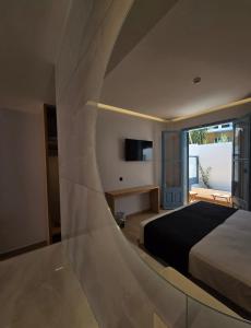 Voodi või voodid majutusasutuse Nireus Hotel toas