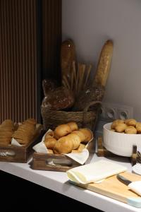 a table with bread and a basket of bagels at Express Tashkent Hotel&Spa in Tashkent