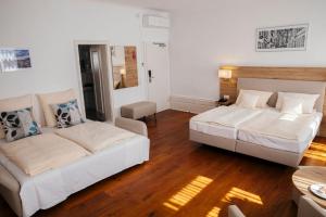 Postel nebo postele na pokoji v ubytování Hotel Perkeo