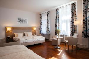 Postel nebo postele na pokoji v ubytování Hotel Perkeo