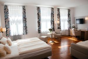 Postel nebo postele na pokoji v ubytování Hotel Perkeo