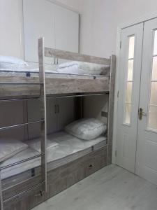 Postel nebo postele na pokoji v ubytování MI Hostel