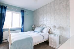 Postel nebo postele na pokoji v ubytování Sea Mist Guesthouse