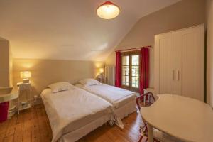 Ένα ή περισσότερα κρεβάτια σε δωμάτιο στο Villa Saint-Bernard