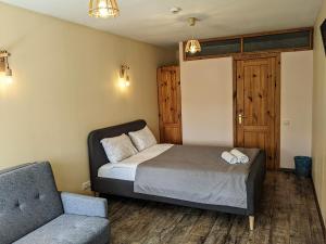Postel nebo postele na pokoji v ubytování Guest House Kamara