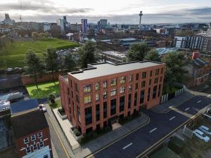 an aerial view of a brick building in a city at Richmond Apartments - Air Host & Stay in Liverpool