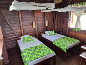 Postel nebo postele na pokoji v ubytování Lakana Hotel