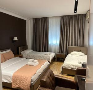 Postel nebo postele na pokoji v ubytování Aurelis Hotel