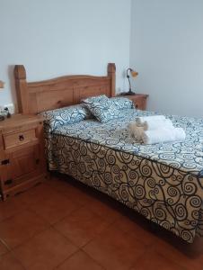 a teddy bear sitting on top of a bed at Apartamento Fray Eloy de 1 habitacion in Guadalupe
