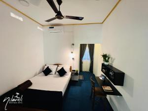 Voodi või voodid majutusasutuse Nilaveli Boutique Hotel toas