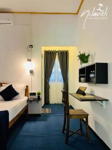 Voodi või voodid majutusasutuse Nilaveli Boutique Hotel toas