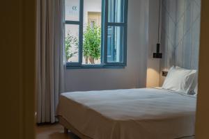 Voodi või voodid majutusasutuse Nireus Hotel toas