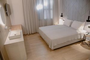 Voodi või voodid majutusasutuse Nireus Hotel toas