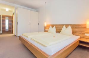 Posteľ alebo postele v izbe v ubytovaní Hotel Bacher Asitzstubn