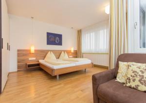 Posteľ alebo postele v izbe v ubytovaní Hotel Bacher Asitzstubn