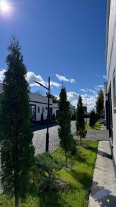 a street light in front of a building with trees at Коттедж в ЦО Атлантис in Chon-Sary-Oy +3 photos