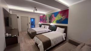 A bed or beds in a room at SAR-PER Hotel