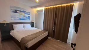 A bed or beds in a room at SAR-PER Hotel