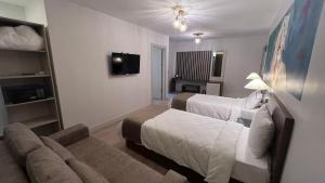 A bed or beds in a room at SAR-PER Hotel