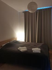 Postel nebo postele na pokoji v ubytování Novi Apartman 19