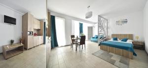 a bedroom with a bed and a table in a room at Alezzi Beach Resort Pool &Spa in Mamaia Sat/Năvodari