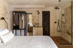 Postel nebo postele na pokoji v ubytování Amalen Suites Adults Only