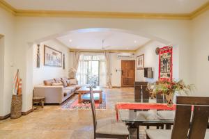a living room with a couch and a table at Amani Luxury Apartment Diani, 2 Bedroom in Galu