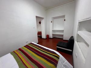 Postel nebo postele na pokoji v ubytování Mallku Wasi - Lodging Hotel Cusco