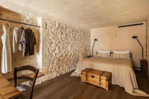 Postel nebo postele na pokoji v ubytování Amalen Suites Adults Only