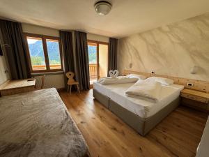 Postel nebo postele na pokoji v ubytování Hotel Savoia