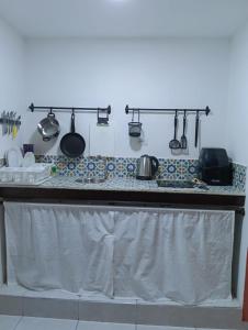 a kitchen counter with pots and pans on it at Apartamento en centro histórico in Cartagena de Indias +1 photo
